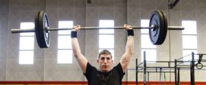 A man lifting weights, strength training