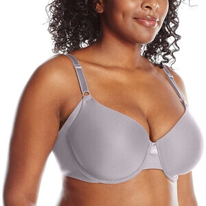 A large busted lady wearing the Olga Women's No Side Effects Underwire Contour Bra. This is arguably the best bra for east west breasts 