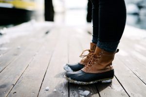 A woman with duck boots, showing how to wear duck boots with skinny jeans