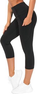 A woman wearing the THE GYM PEOPLE Thick High Waist Capri Yoga Pants with Pockets, Tummy Control Workout Running Yoga Leggings for Women. Capri leggings are ideal for informal style