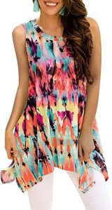 A lady modelling the Viracy Women's Summer Casual Sleeveless Swing Tunic Floral Tank Top (S-3XL). One of the best summer tunics to wear with leggings, best tunic tops for women to wear leggings