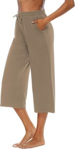 A lady showcasing the OYANUS Capris for Women for Summer, Loose, Comfy, Drawstring, Wide-Leg Capri Pants with Pockets 